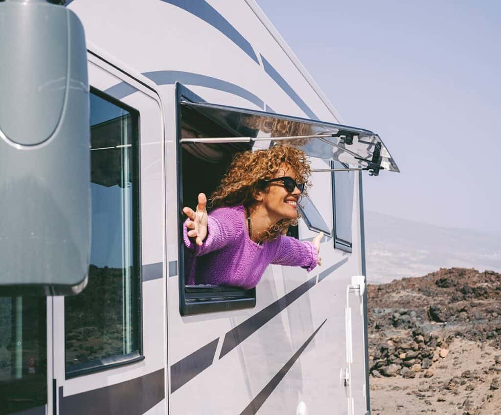 Smiling woman in RV window