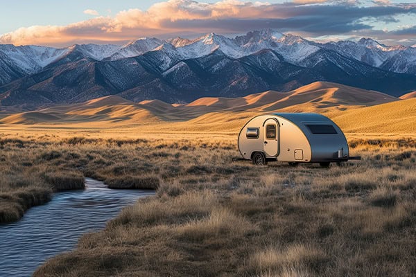 Teardrop trailer near stream
